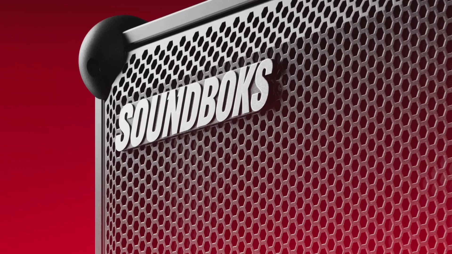 Close-up of a Soundboks speaker showcasing its distinctive design and powerful audio presence. The video highlights the speaker from different angles.