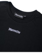 Black cropped tee with Jägermeister logo.