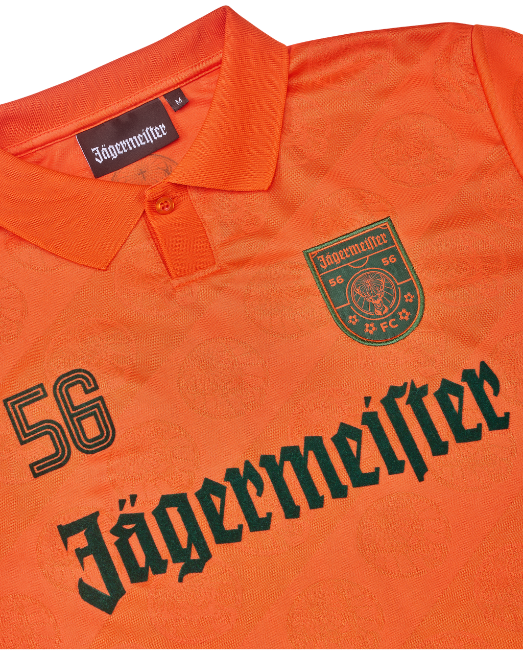 Narancssárga mez Jägermeister márkajelzéssel.