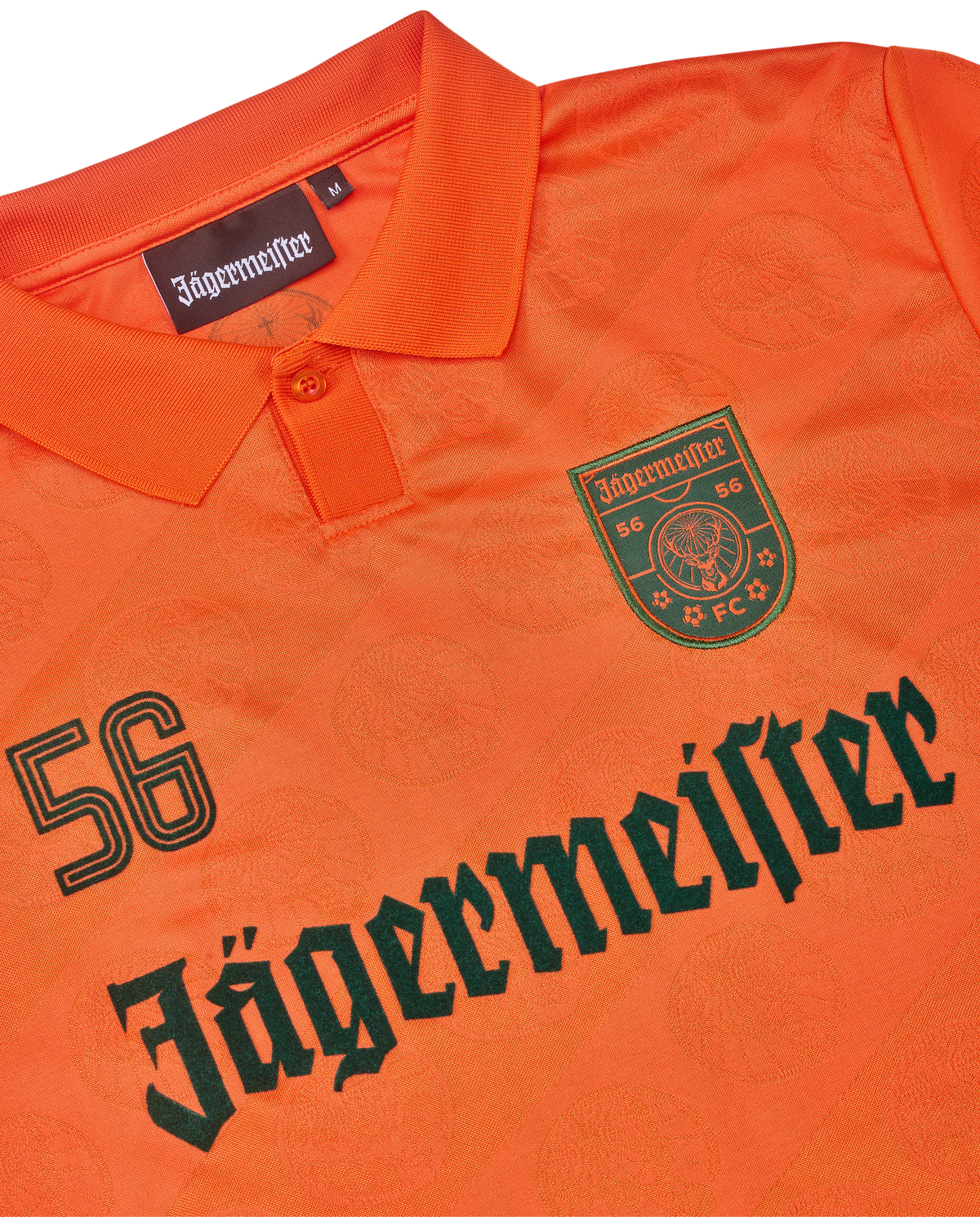 Narancssárga mez Jägermeister márkajelzéssel.