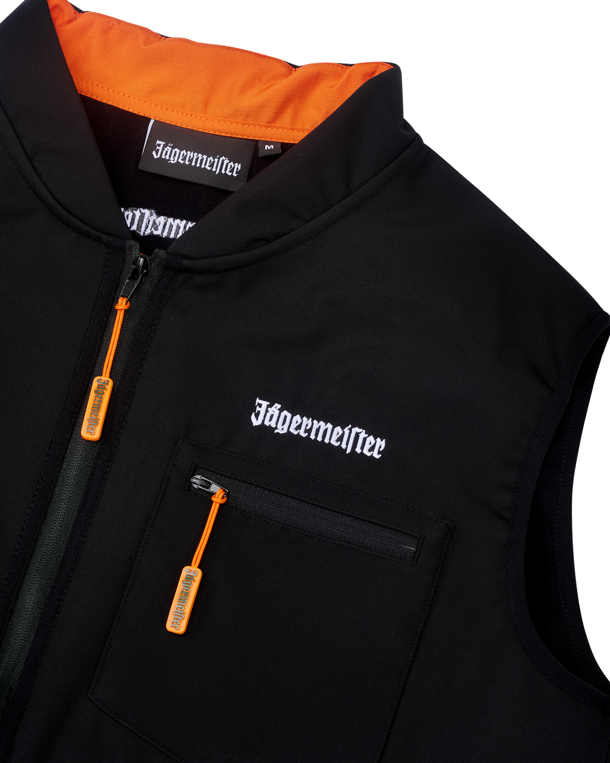 Fekete Jägermeister taktikai mellény fehér Jägermeister szójel márkajelzéssel és narancssárga cipzárral.