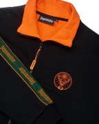 Black jacket with orange collar and Jägermeister branding on the chest and the sleeve.