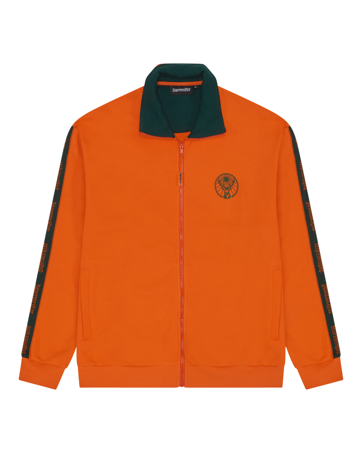 Narancssárga tréningdzseki zöld gallérral és zöld Jägermeister márkajelzéses részletekkel.